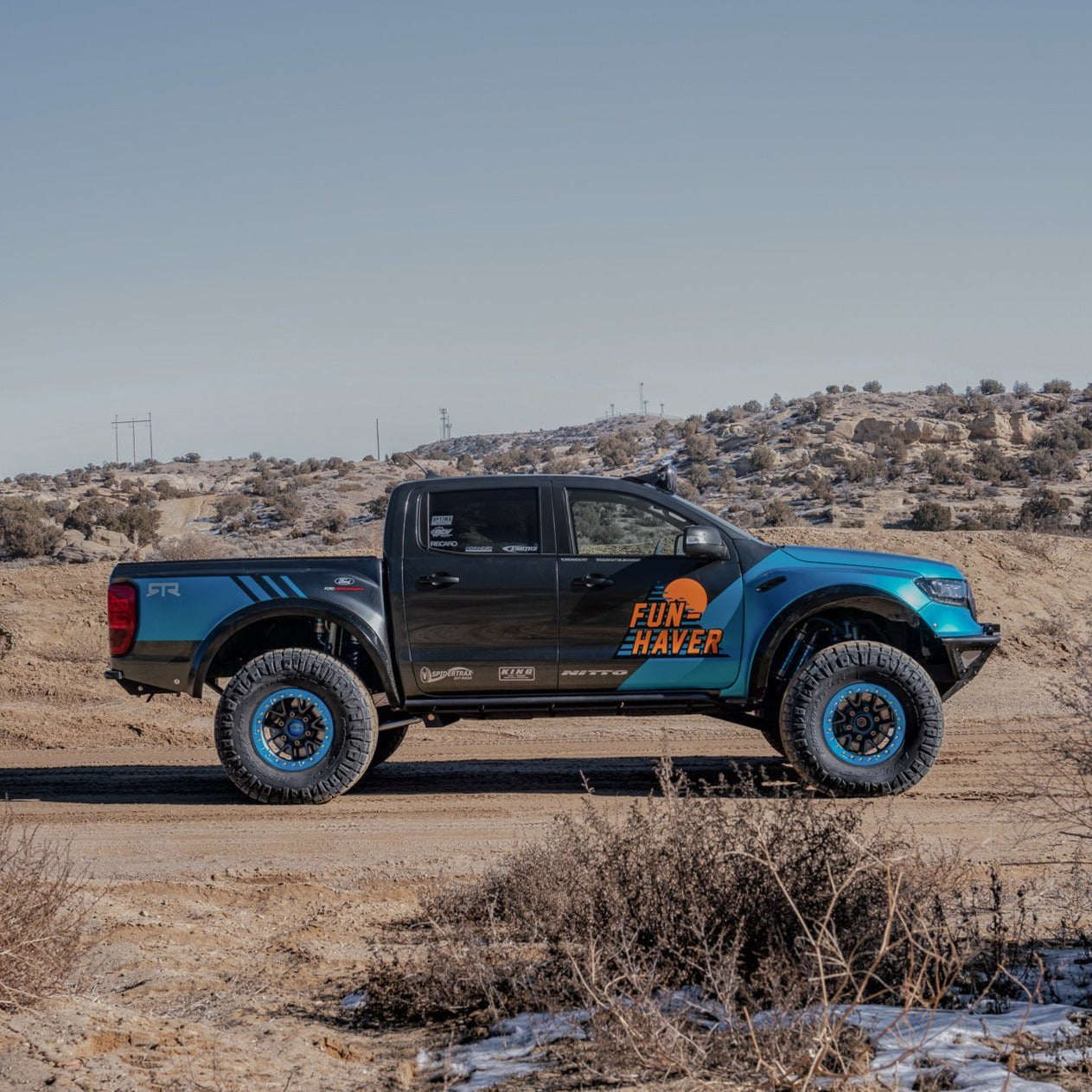 2019-2022 Ford Ranger with custom bedsides, showcasing offroad capabilities in a desert landscape.