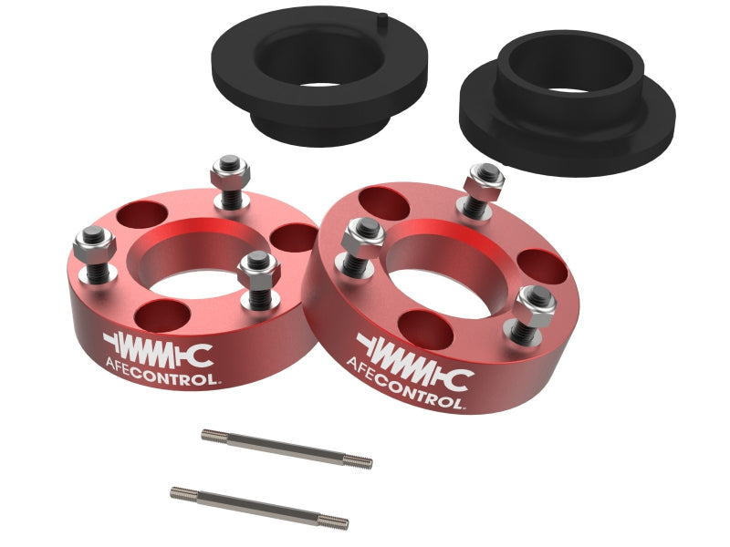 aFe CONTROL 3.0 IN Leveling Kit for 2021 RAM 1500 TRX featuring red spacers and installation hardware for enhanced lift.