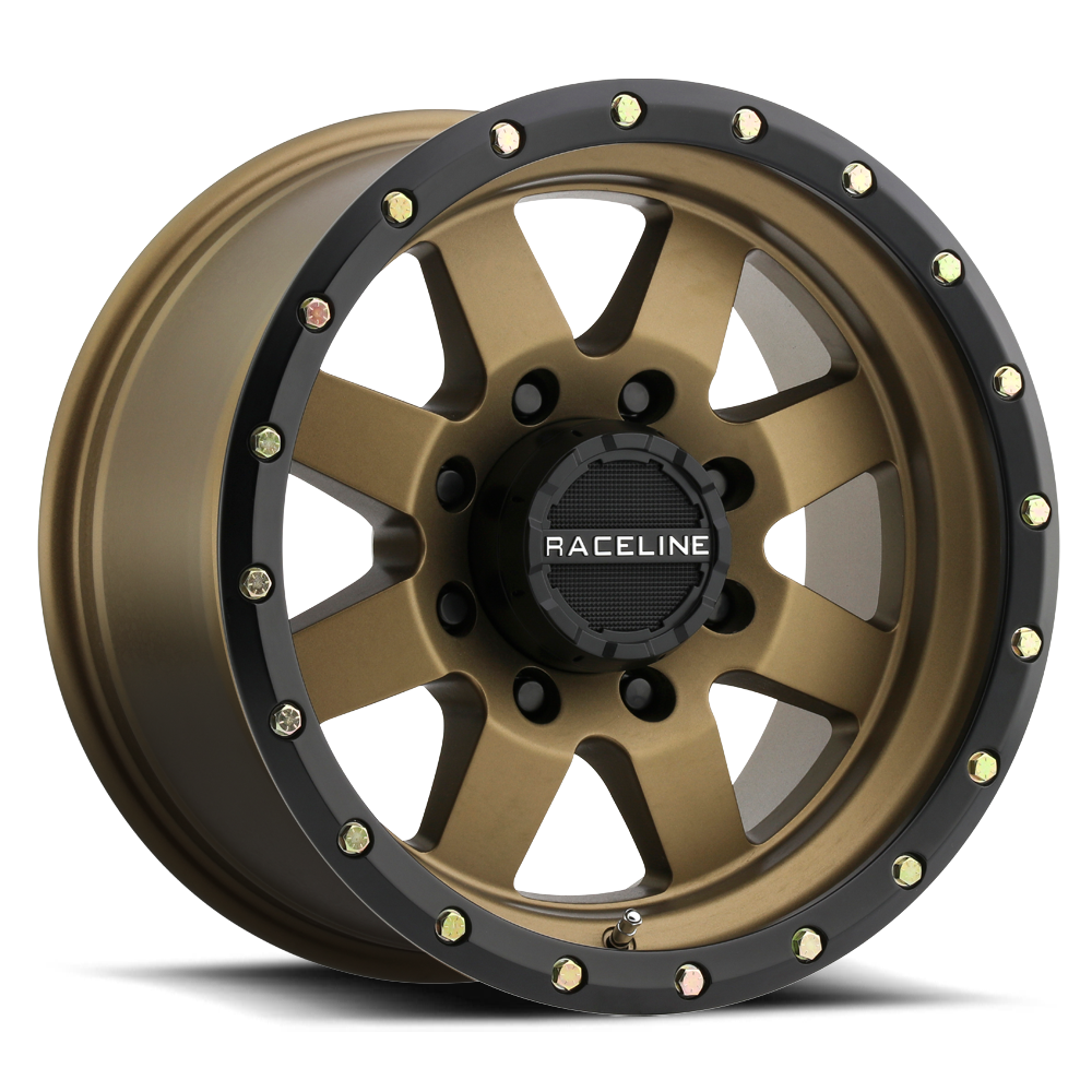 935BZ Defender wheel showcasing a rugged design with a bronze finish and black accents, ideal for offroad vehicles.
