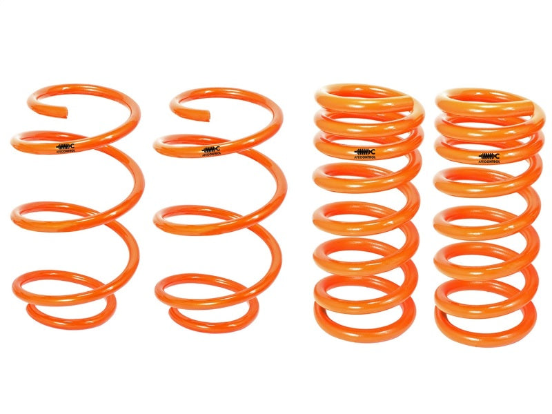 aFe Control lowering springs for 2015 Ford Mustang L4/V6, featuring a vibrant orange finish for enhanced performance and style.