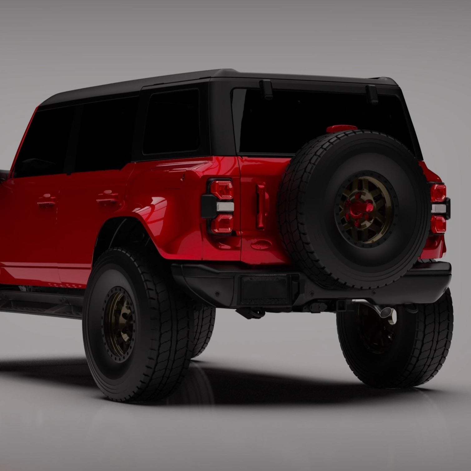 2022-2024 Ford Bronco Raptor rear quarter kit showcasing a bold red SUV with off-road tires and a spare tire mounted.