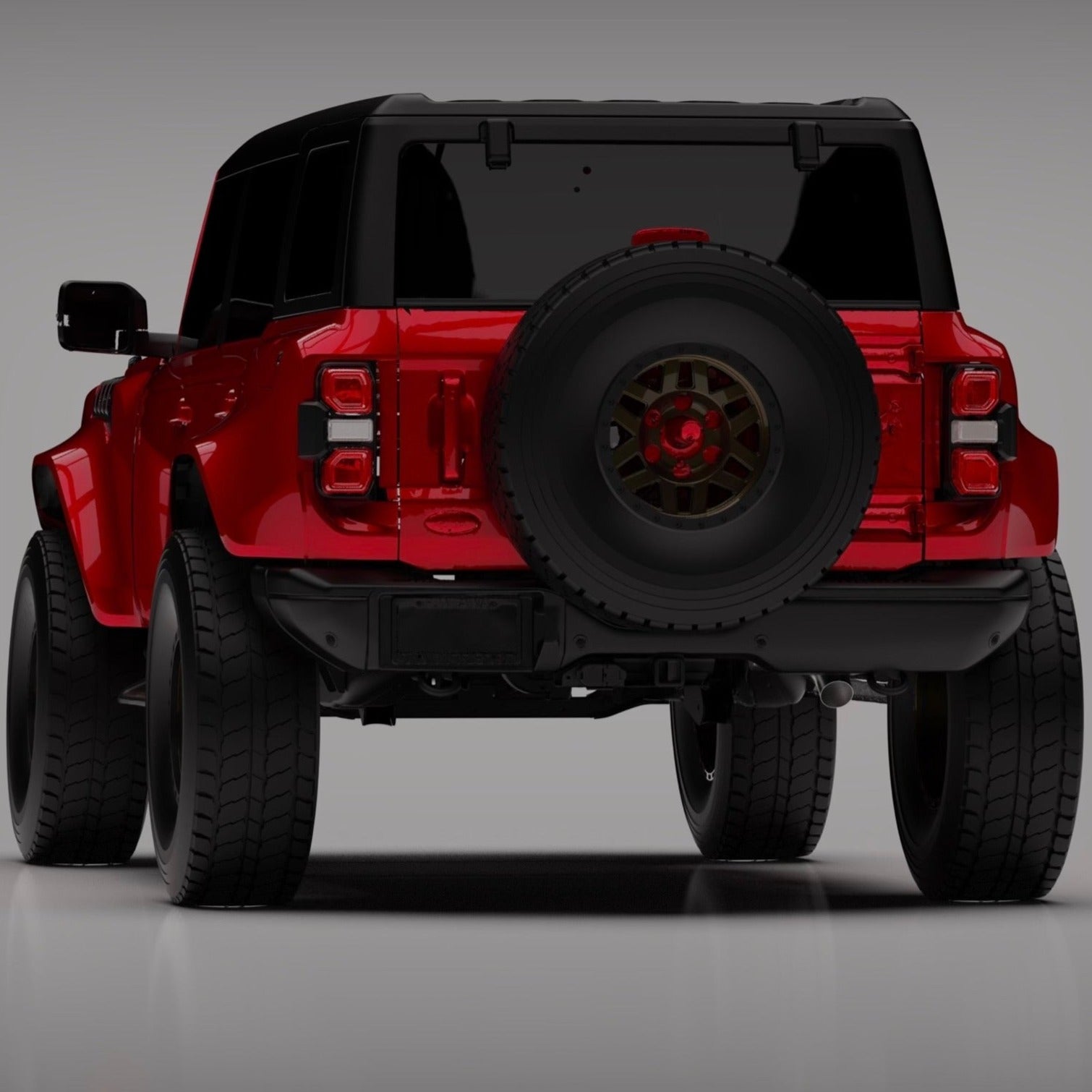 2022-2024 Ford Bronco Raptor rear quarter kit showcasing a red SUV with a large spare tire and aggressive stance.