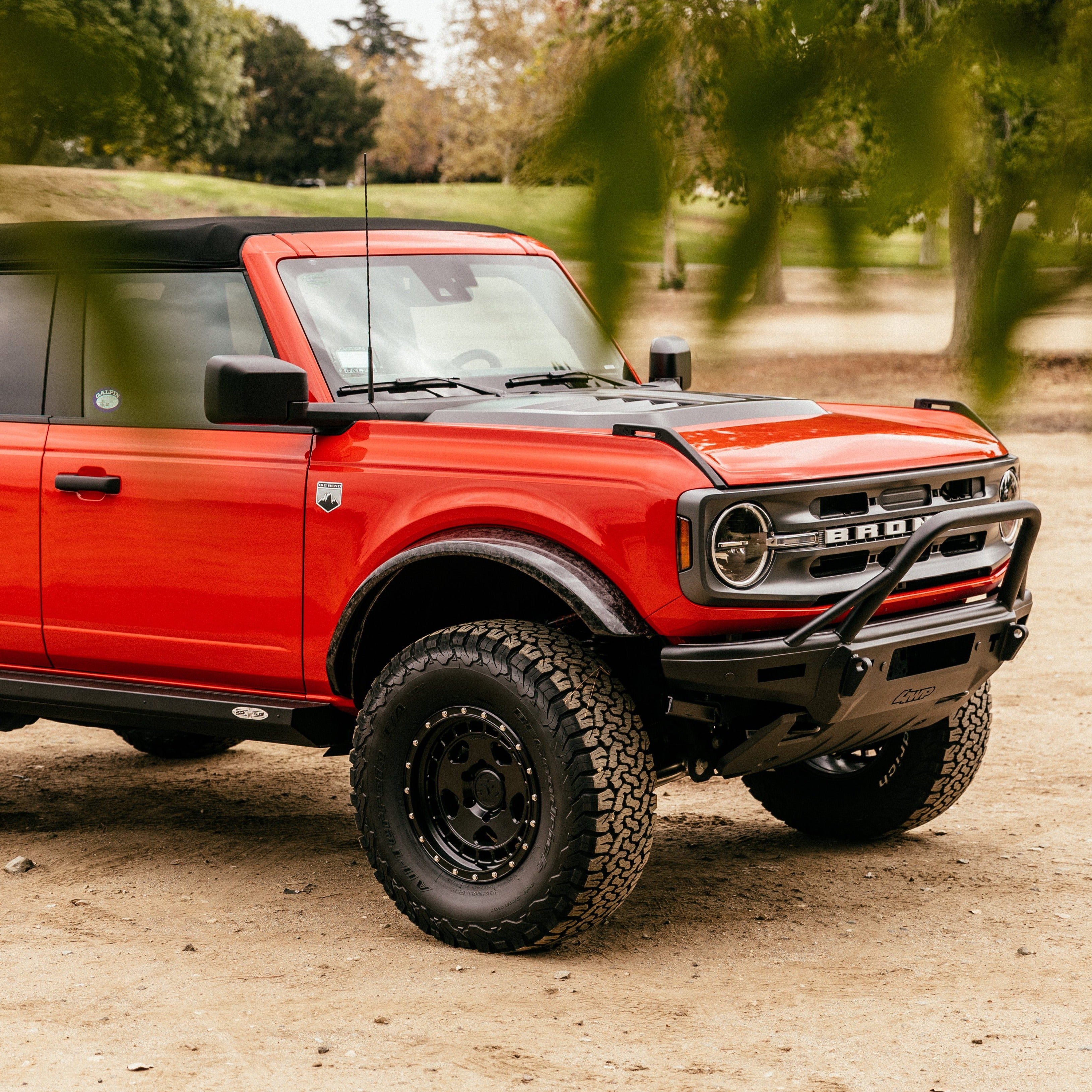 2021-2024 Ford Bronco Sasquatch Flares enhancing the rugged look of a red Bronco with off-road tires and accessories.