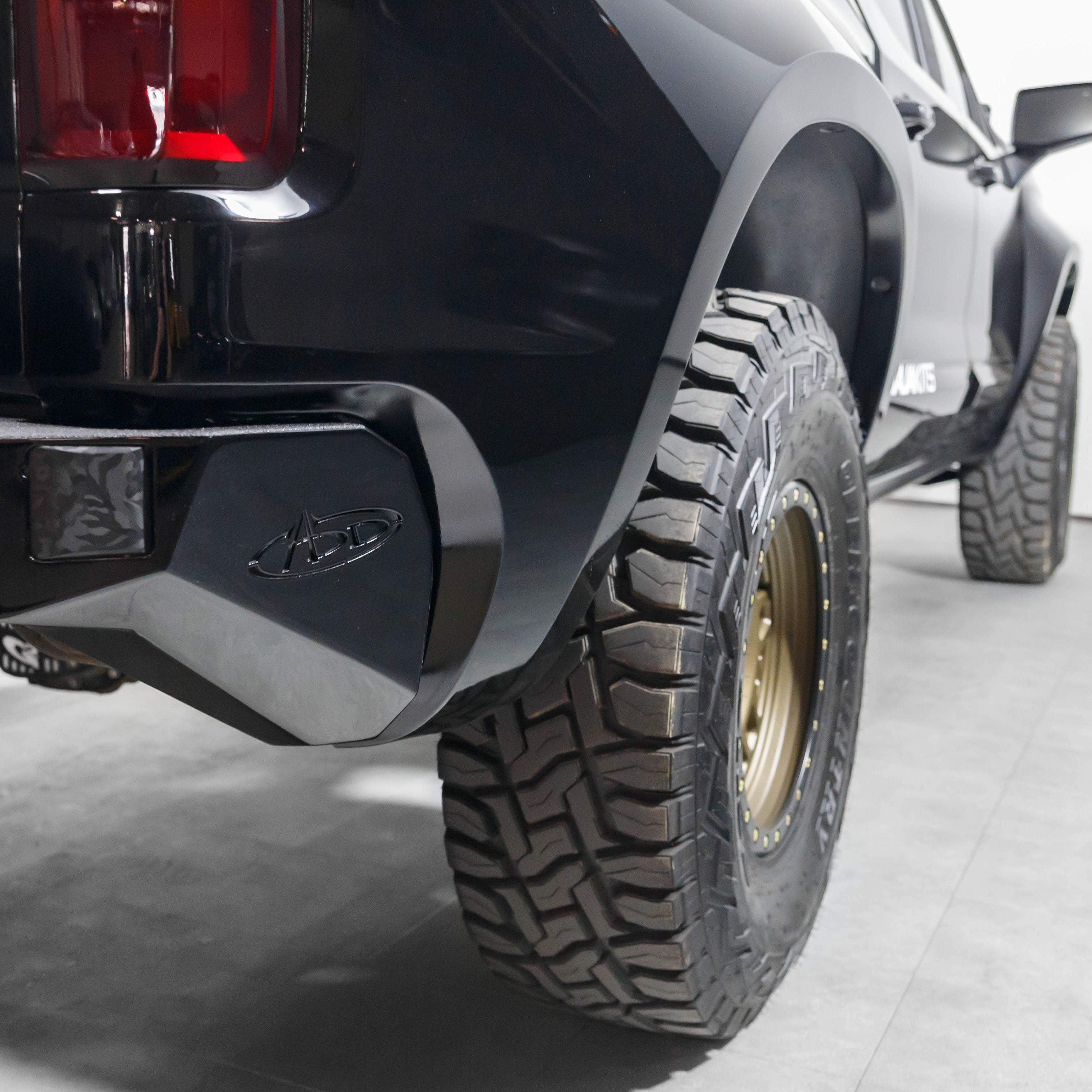 2019-2021 Chevrolet Silverado bedsides showcasing a rugged design, paired with off-road tires and a sleek black finish.