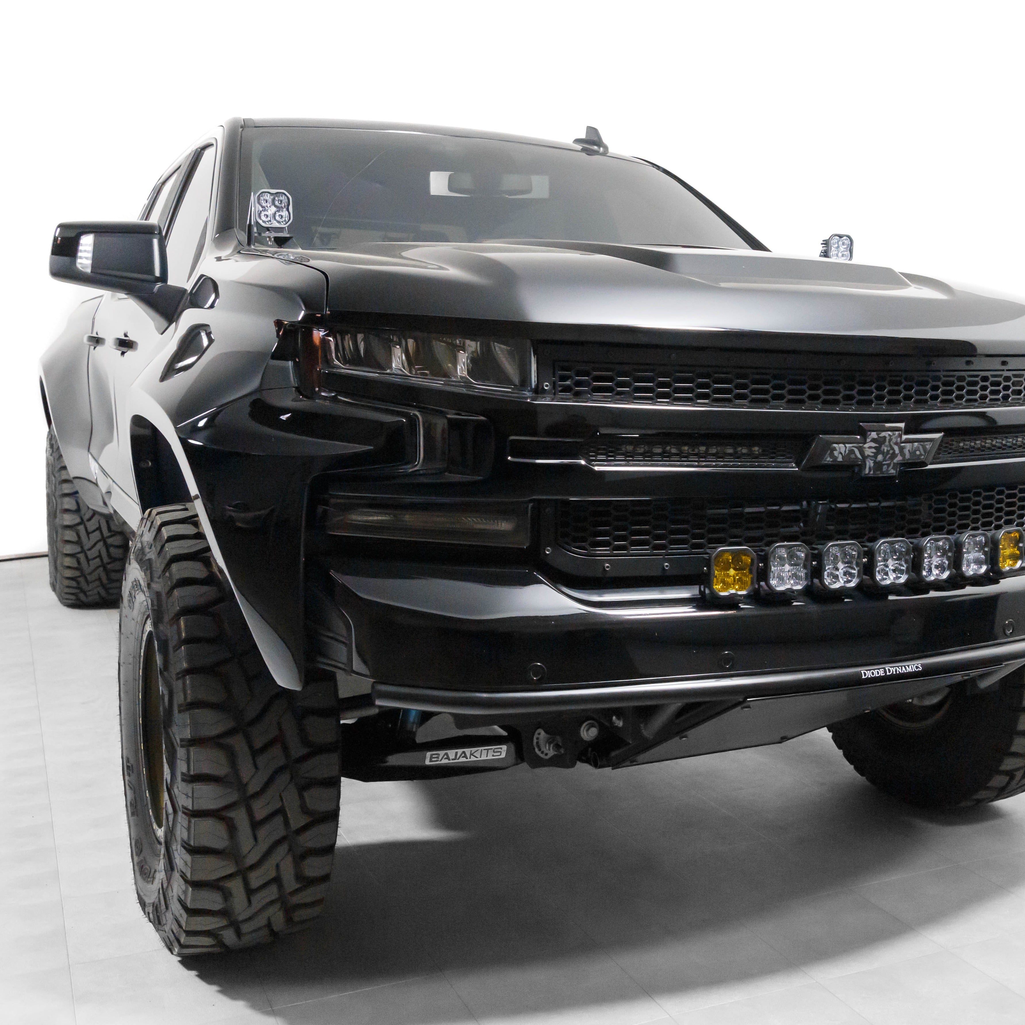 2019-2021 Chevrolet Silverado with custom fenders showcasing a rugged offroad design and enhanced front lighting.