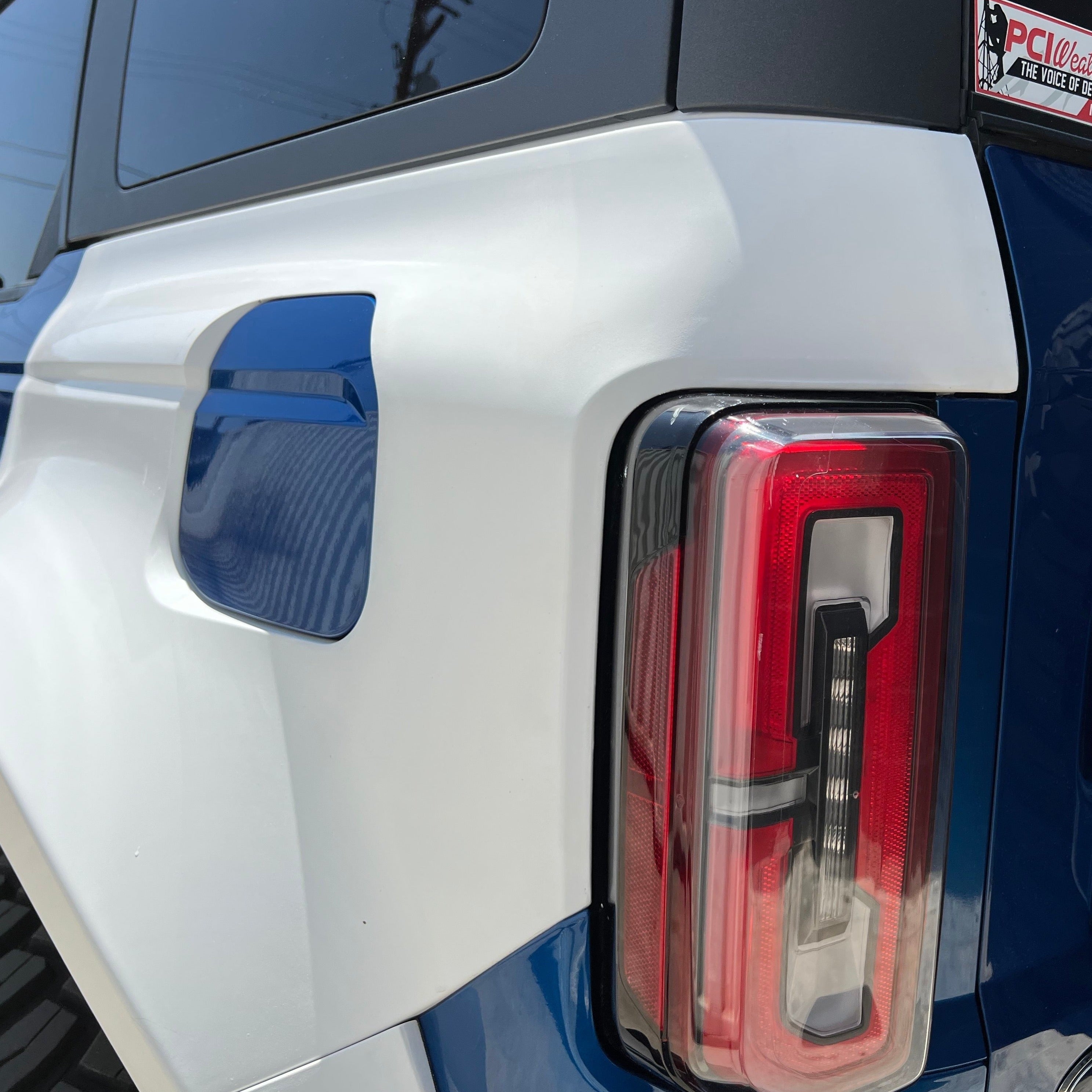 2021-2022 Ford Bronco 4-Door Rear Quarter Kit showcasing the rear panel and taillight design in blue and white.