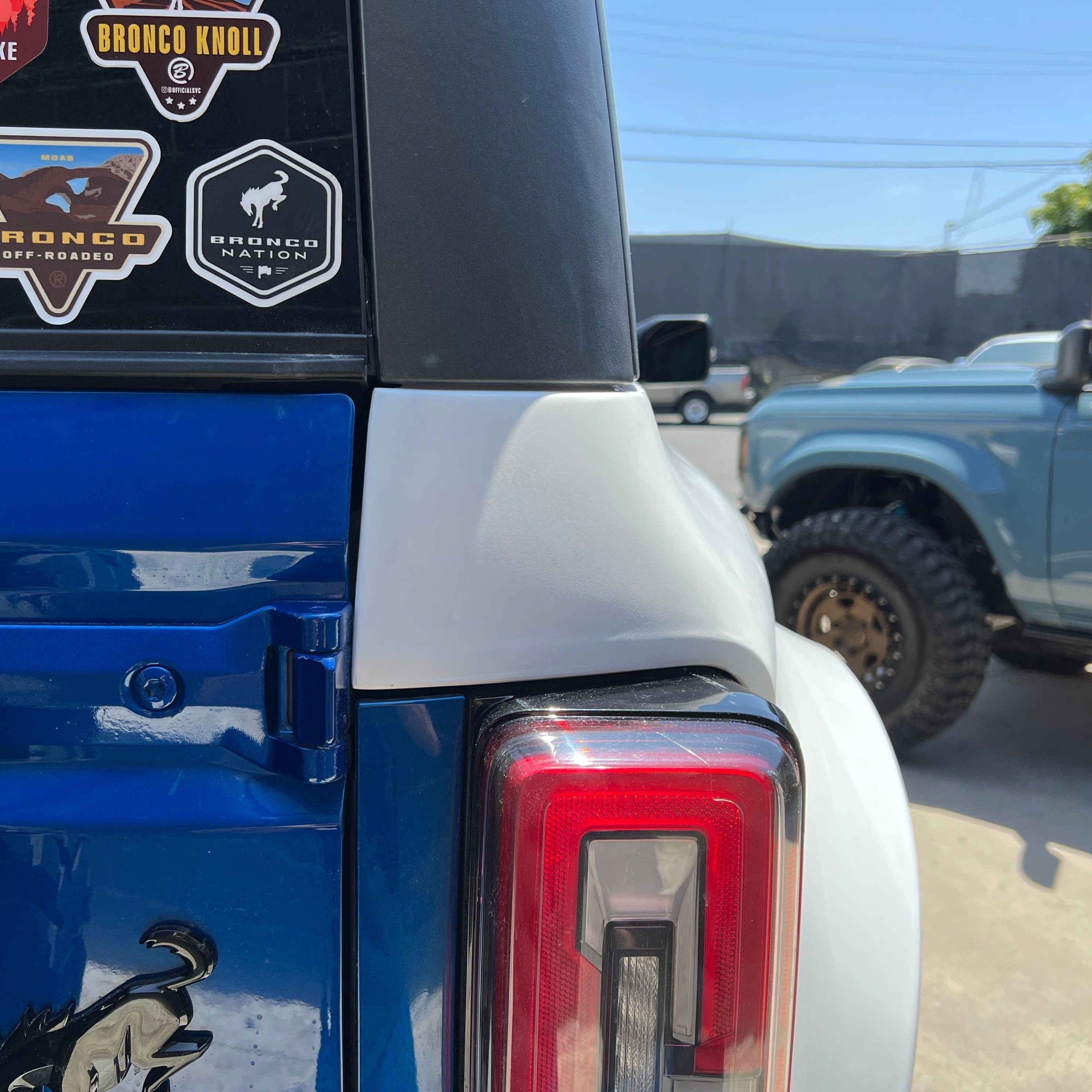 2021-2022 Ford Bronco 4-Door Rear Quarter Kit installed on a blue Bronco, showcasing its sleek design and fit.