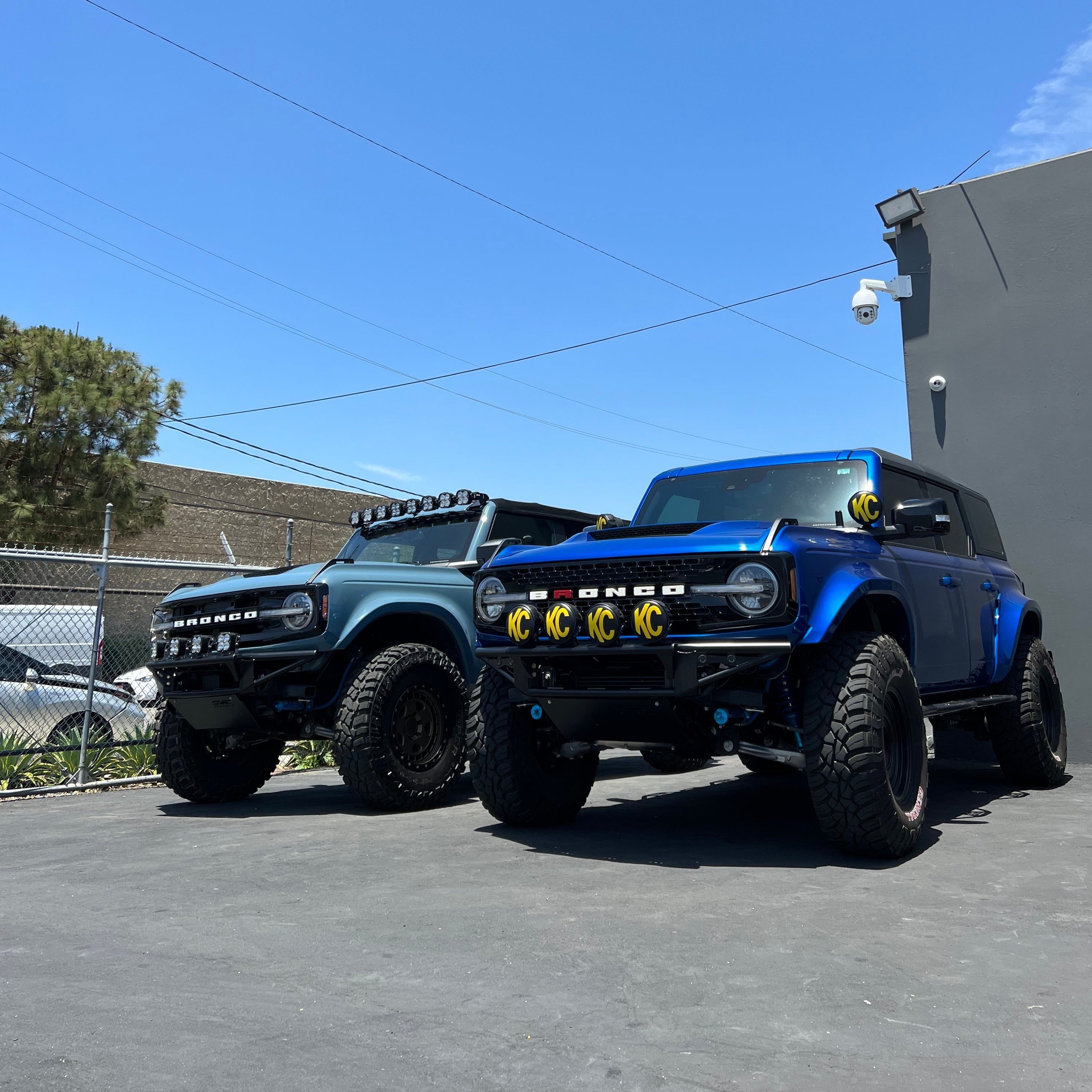 2021-2022 Ford Bronco fenders showcased on two modified Broncos with off-road tires and accessories.