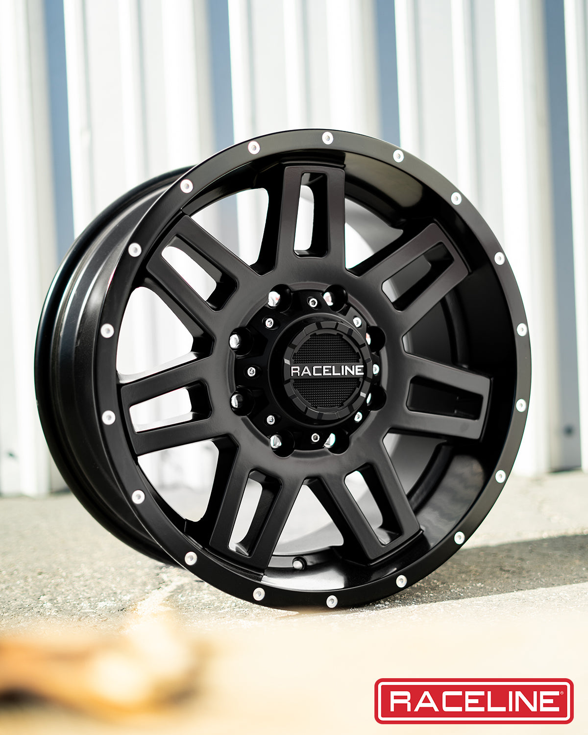 Black Raceline 931B wheel with a bold design and polished accents, ideal for trucks and offroad vehicles.