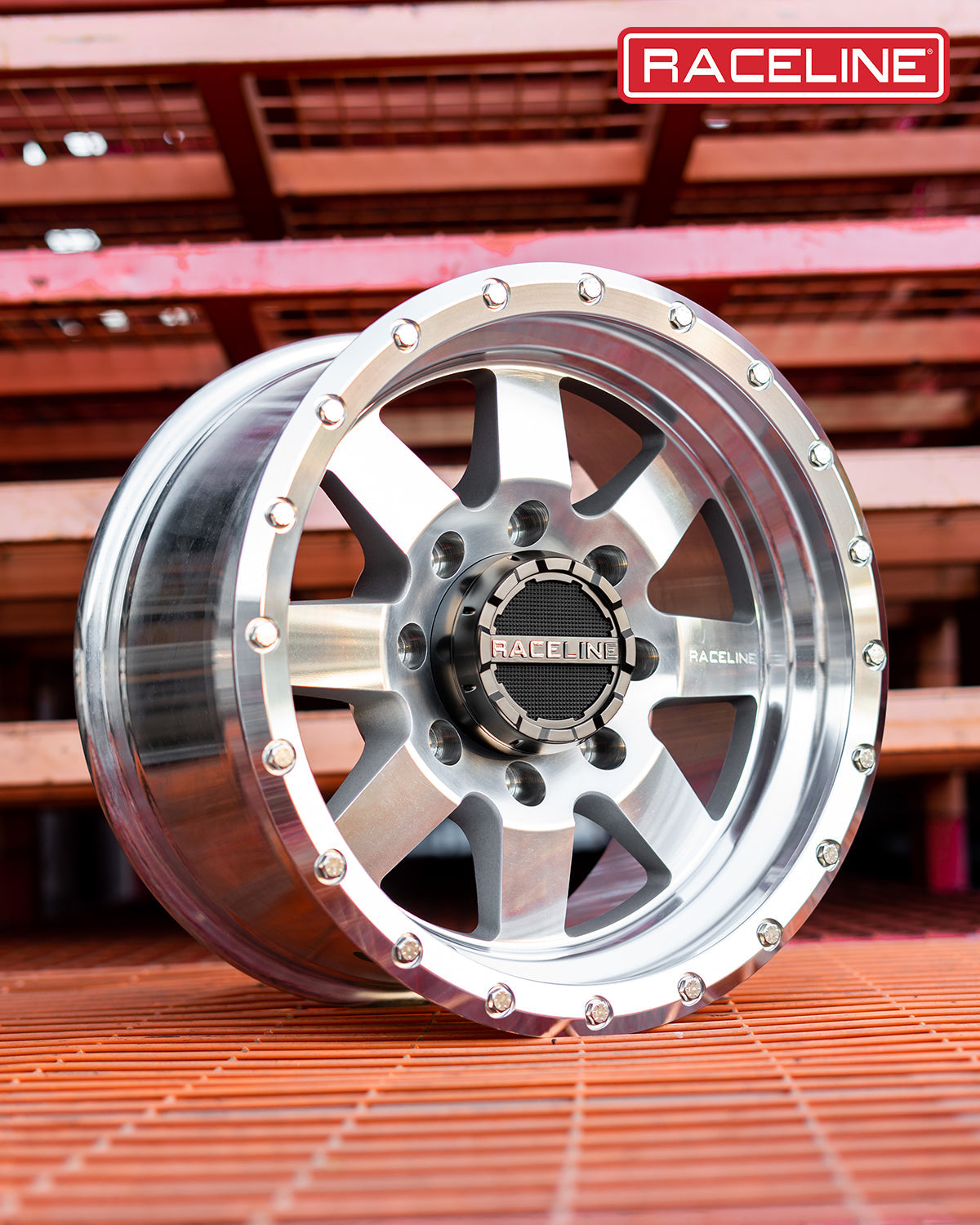 Aluminum Raceline 935MC Defender wheel showcasing a polished finish and bolt accents, ideal for offroad vehicles.