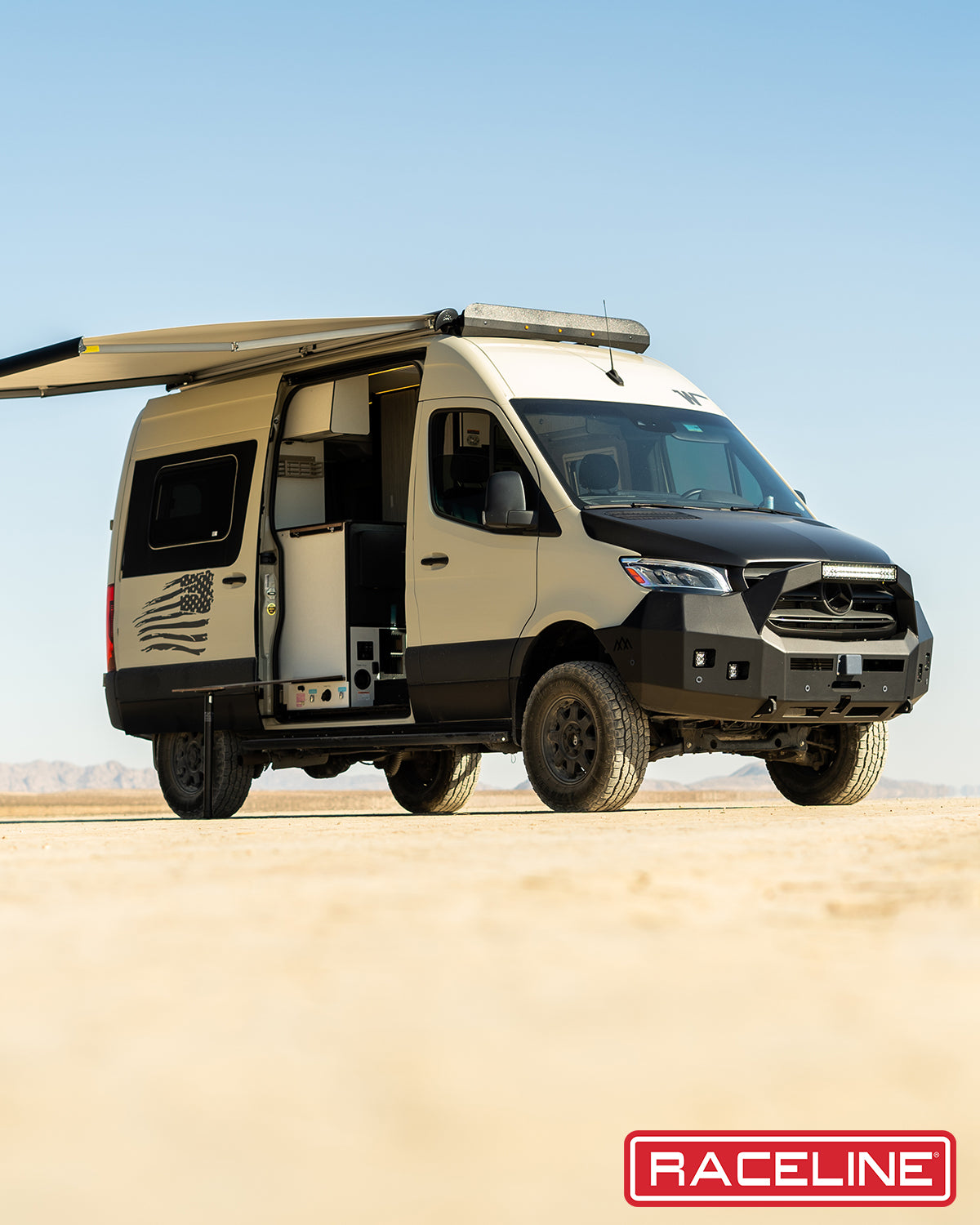 947B Scout Van with a rugged design, parked on a desert landscape, showcasing its offroad capabilities and spacious interior.