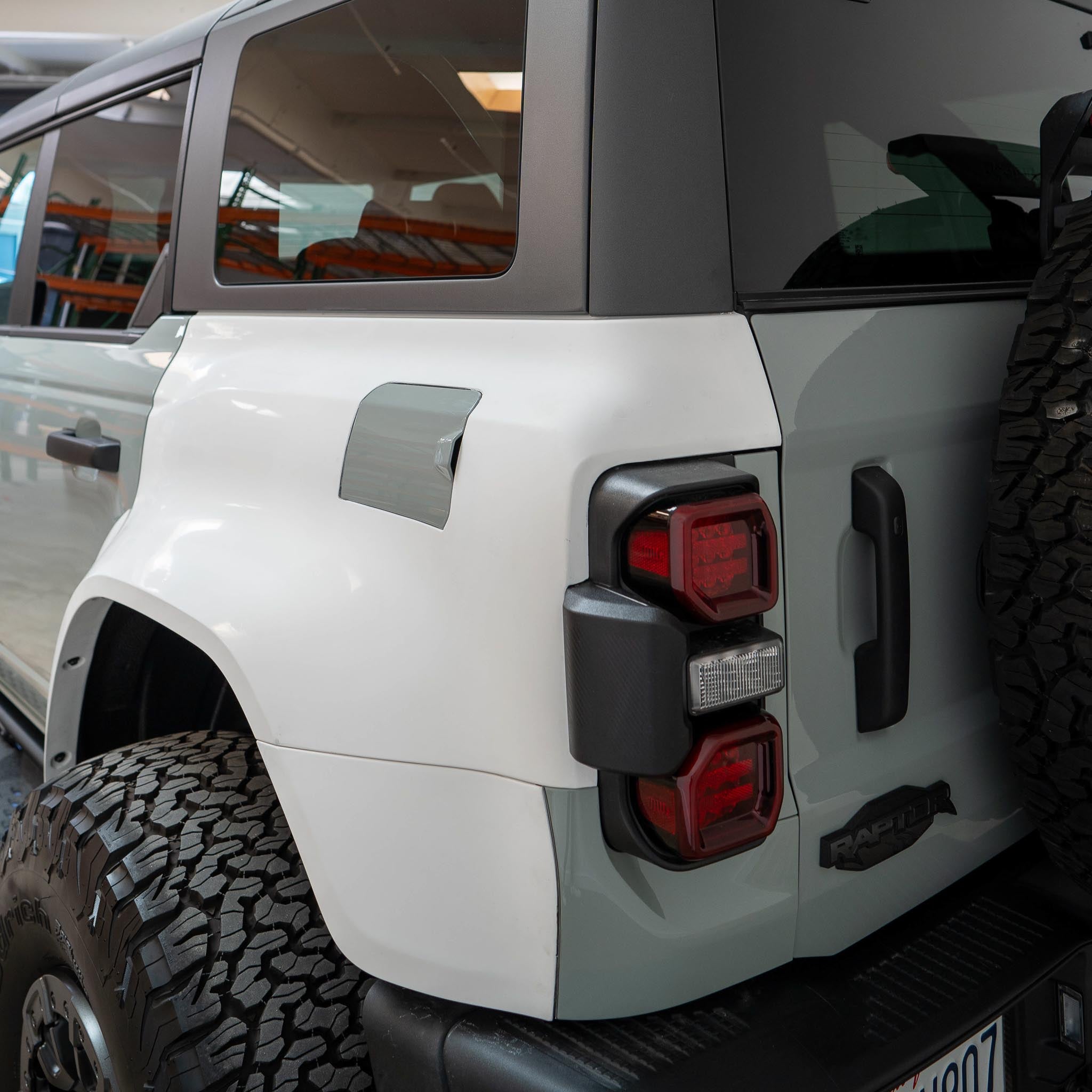 2022-2024 Ford Bronco Raptor rear quarter kit showcasing the sleek design and integrated taillights for enhanced style.