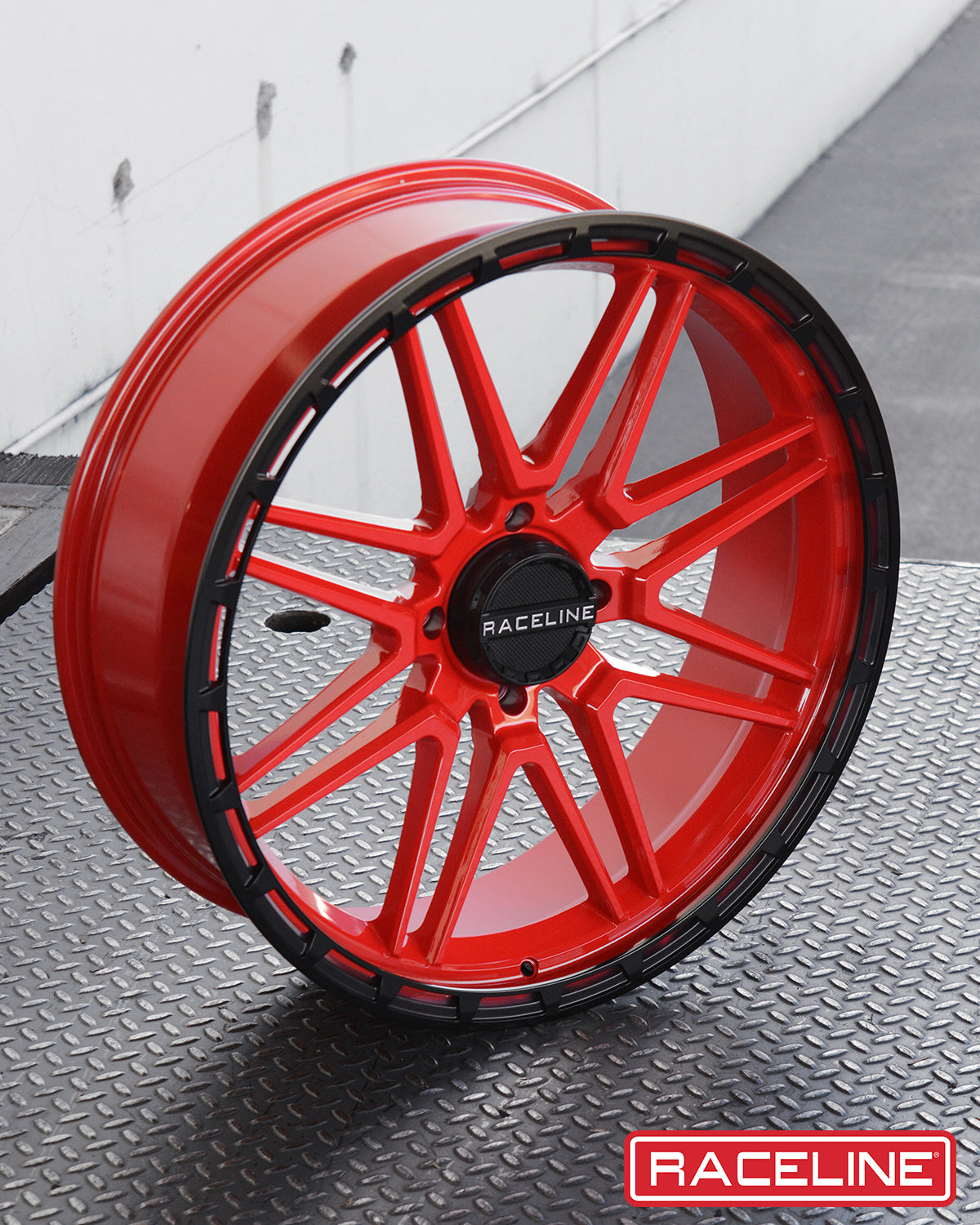 A11R Krank XL wheel featuring a striking red finish with black accents, designed for offroad vehicles.