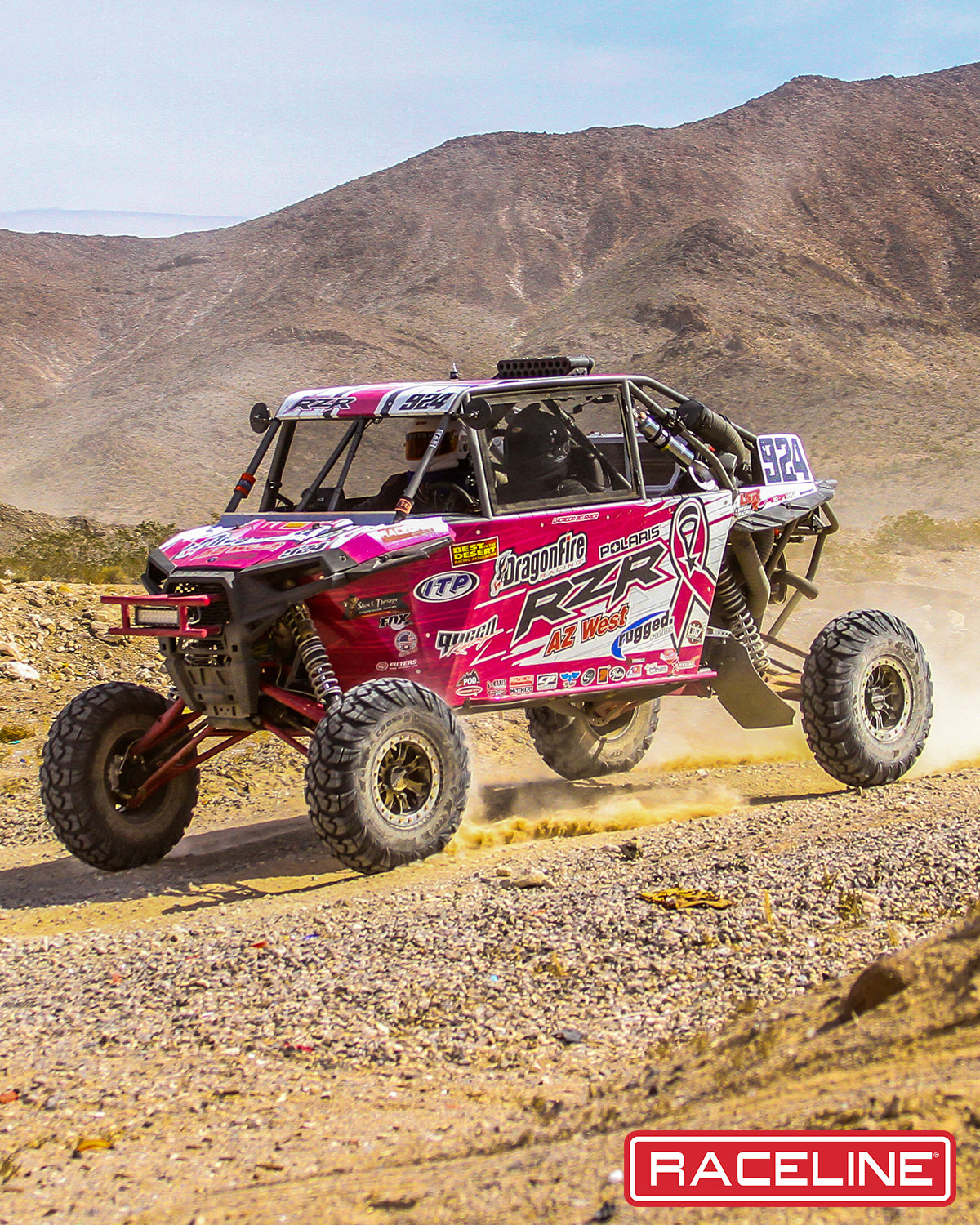 A71 Mamba Beadlock wheel mounted on a pink UTV racing through a desert landscape, showcasing offroad performance.