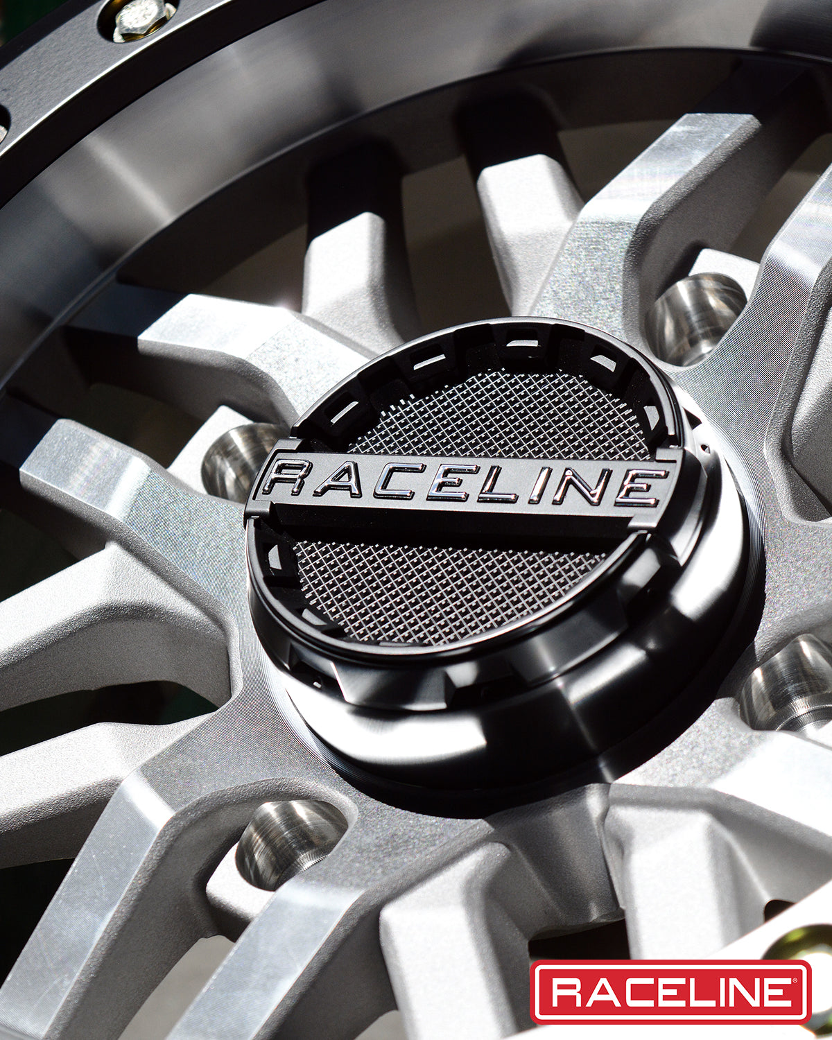 A91MA Ryno Beadlock wheel featuring a sleek design with a black center cap and silver spokes, ideal for offroad vehicles.