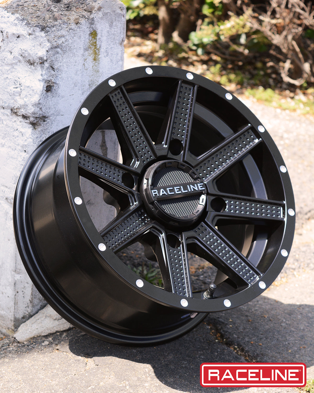 Black A92B Hostage wheel by Raceline, featuring a multi-spoke design and polished accents, ideal for offroad vehicles.