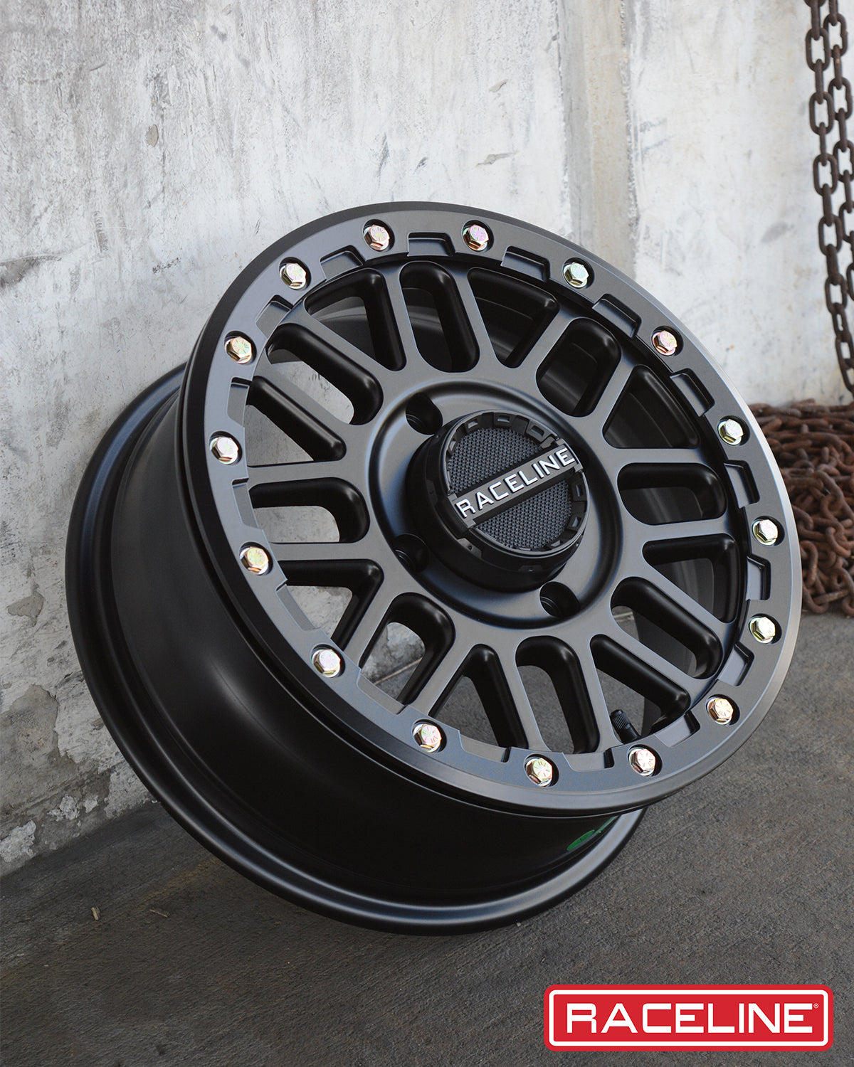 A93B Podium Beadlock wheel featuring a black finish and colorful beadlock accents, ideal for offroad vehicles.