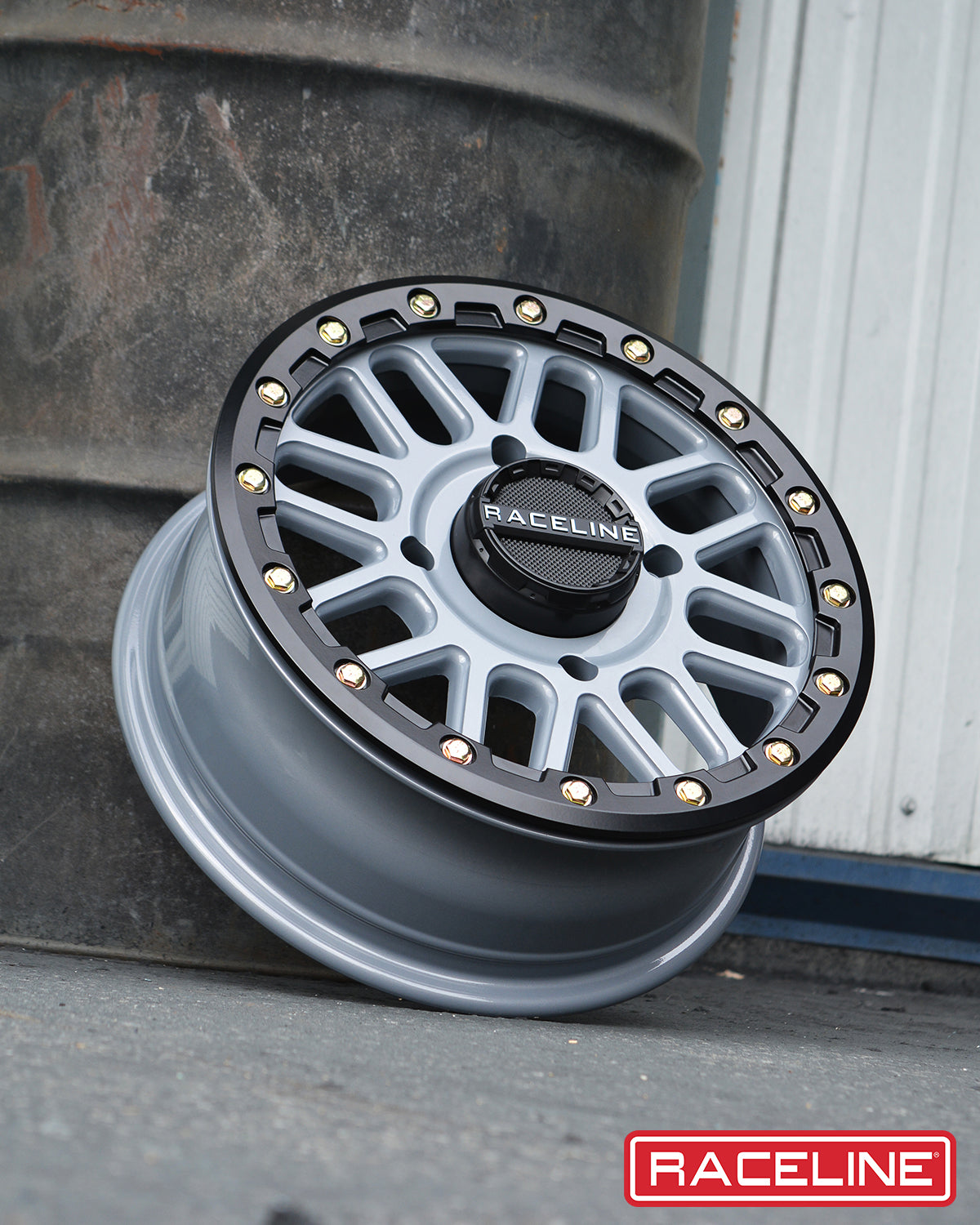 A93SG Podium Beadlock wheel with a sleek design, featuring a black and silver finish, ideal for offroad vehicles.