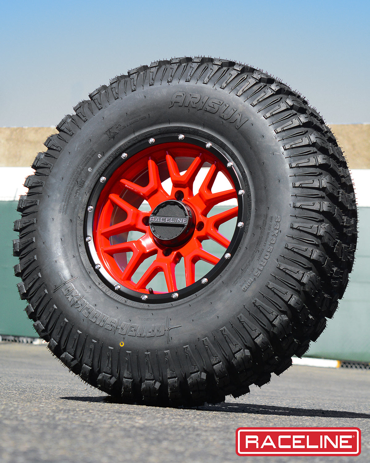 A94R Krank Simulated Beadlock tire with a rugged tread design and vibrant red wheel, ideal for offroad vehicles.