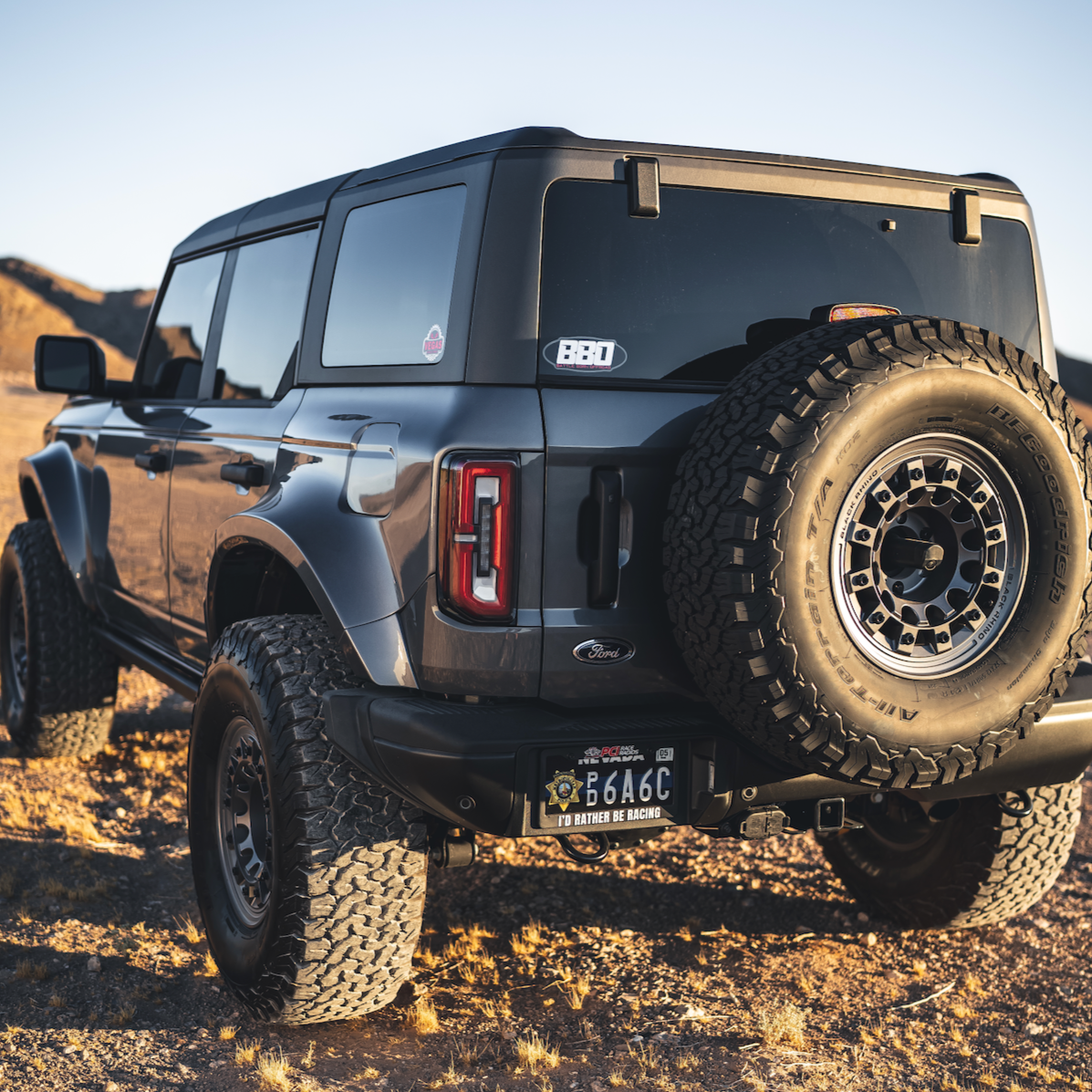 2021-2022 Ford Bronco 4-Door with a rear quarter kit, showcasing rugged offroad capabilities in a desert landscape.