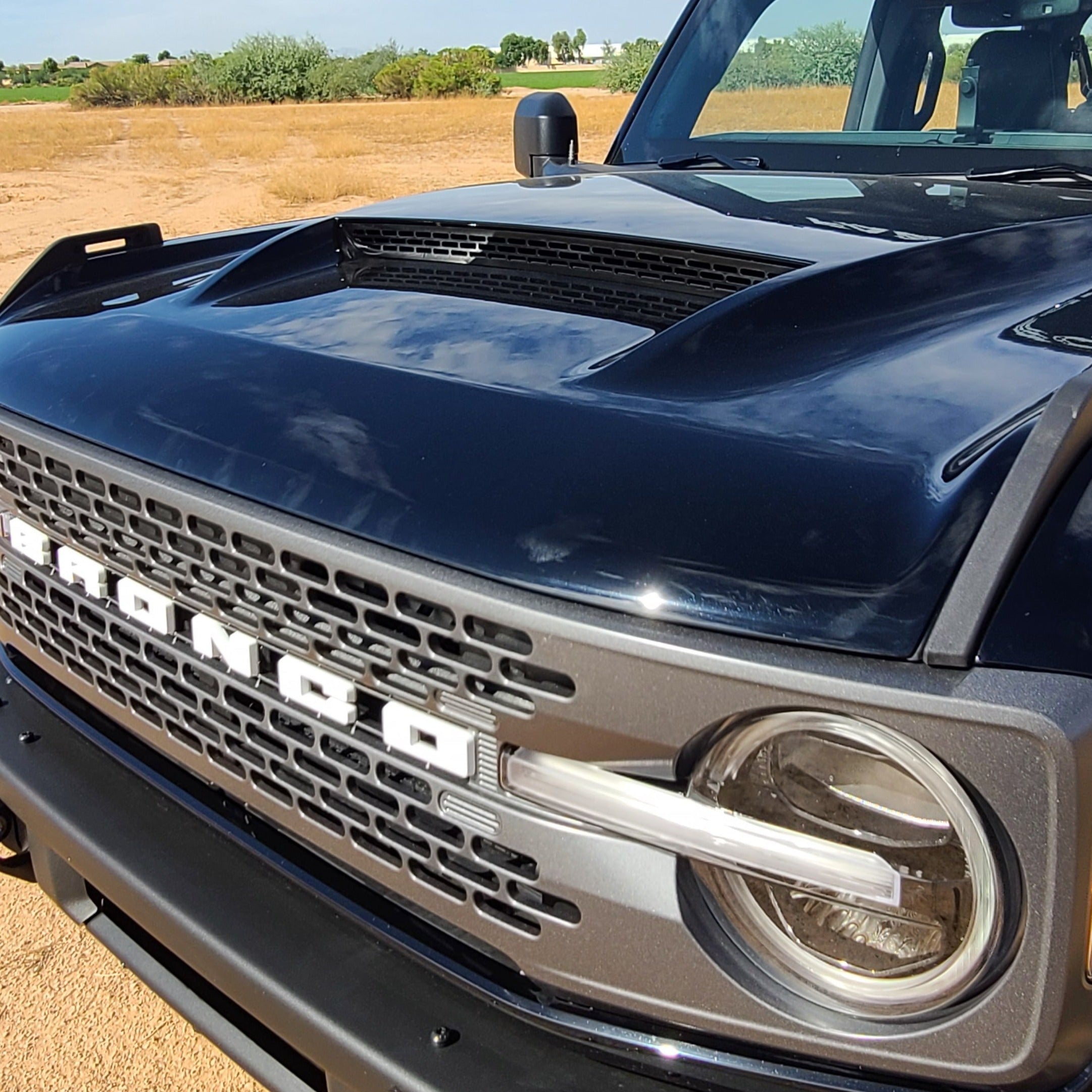 2021-2024 Ford Bronco Ram Air Hood showcasing a sleek design with a prominent air intake and bold front grille.