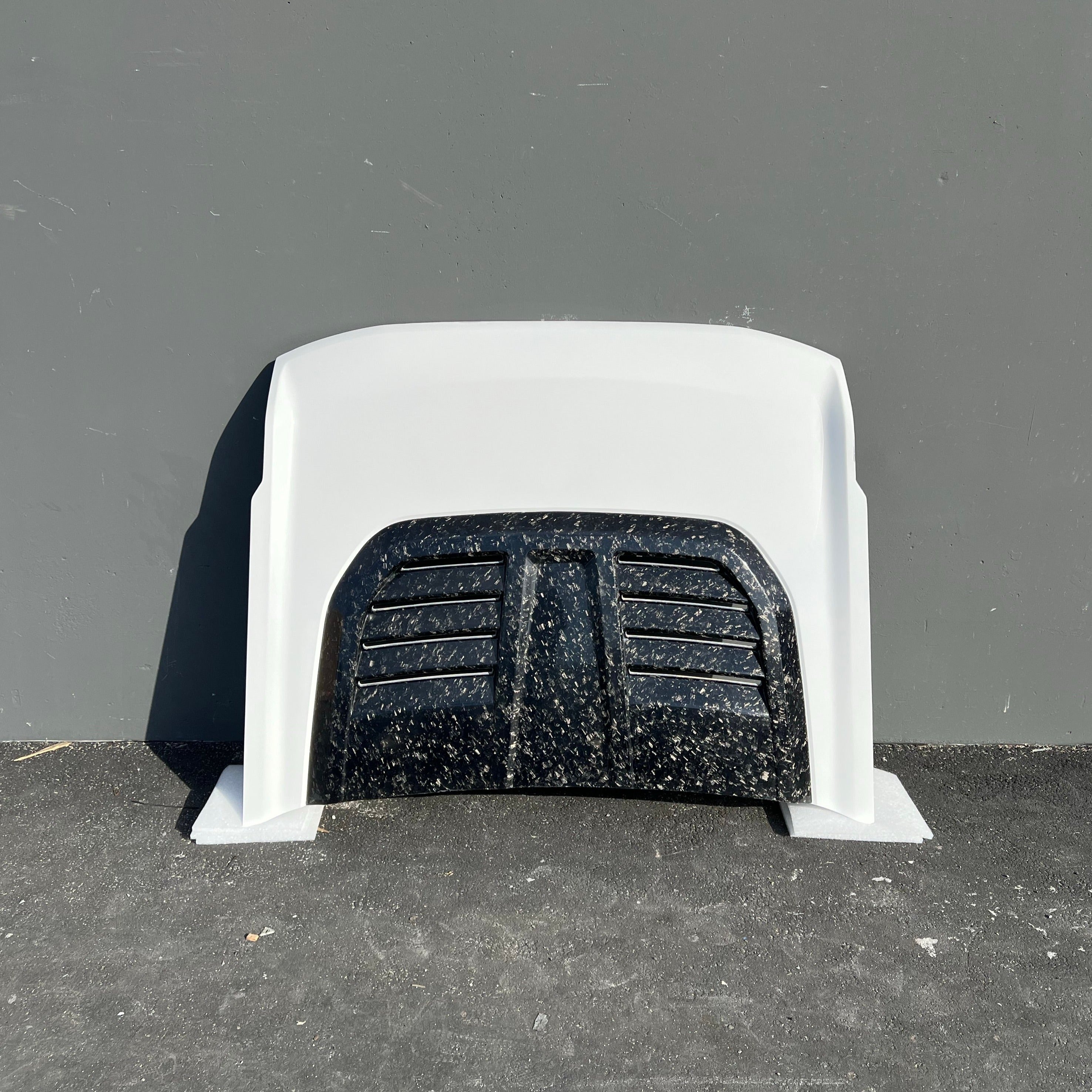 2021-2024 Ford Bronco heat extractor hood showcasing a sleek design with a textured black grille for improved airflow.