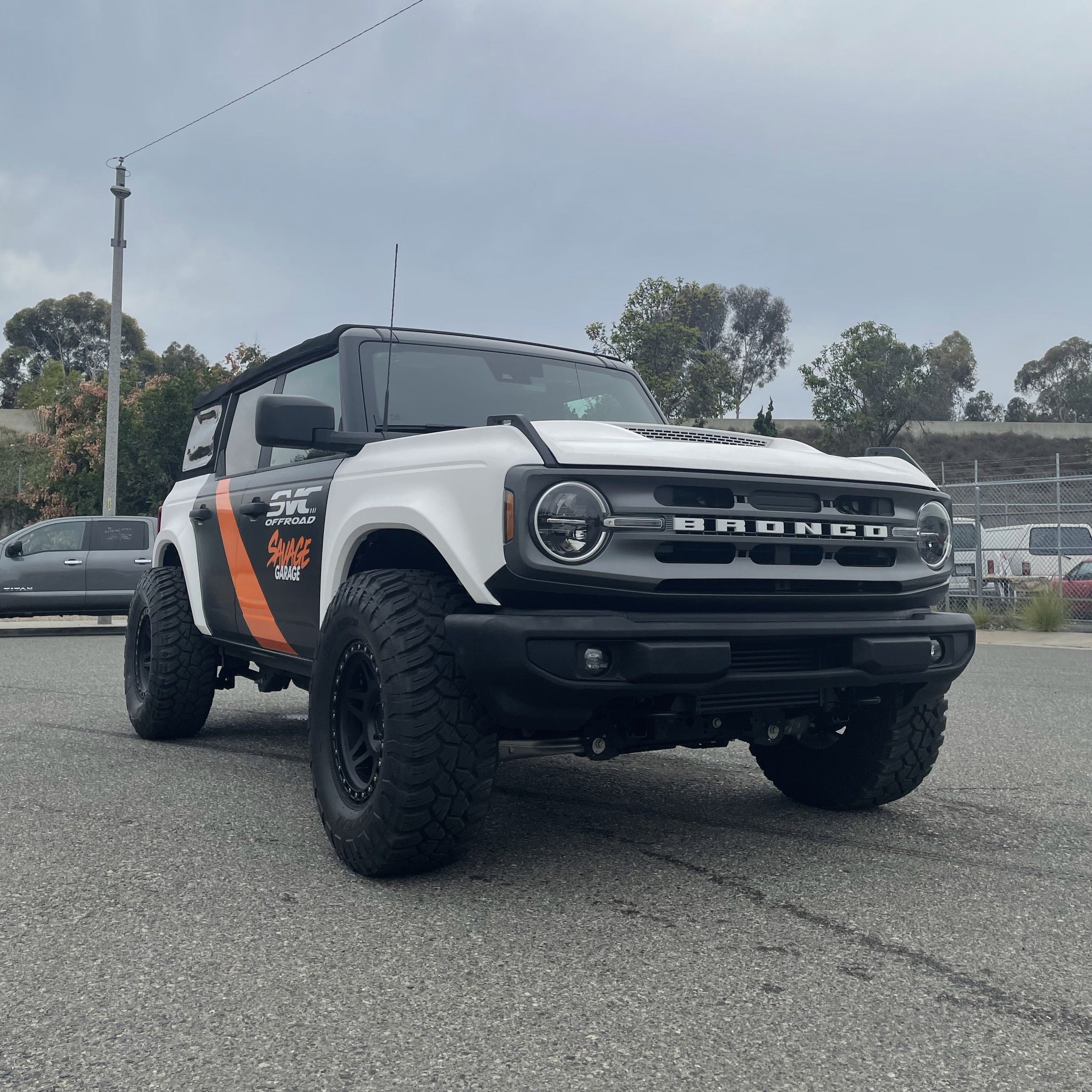 2021-2022 Ford Bronco with aftermarket fenders, showcasing a rugged offroad design and enhanced tire clearance.