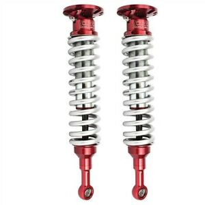 aFe Toyota Tacoma L4 2.7L front coilover kit featuring 2.5-inch shocks with adjustable compression for enhanced performance.